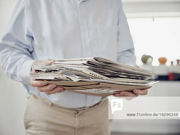 Close up of man holding waste paper