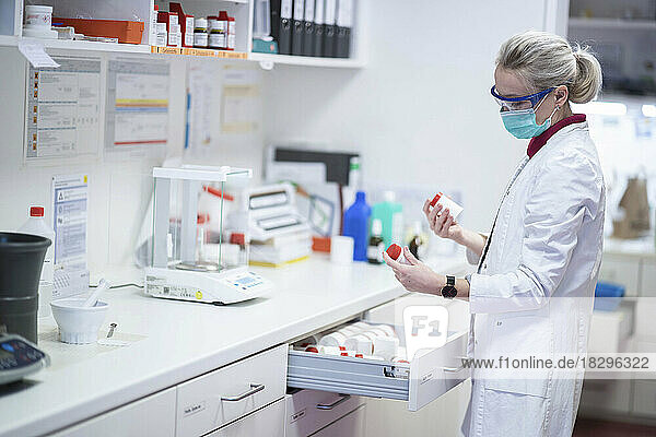 Scientist choosing medicine at laboratory