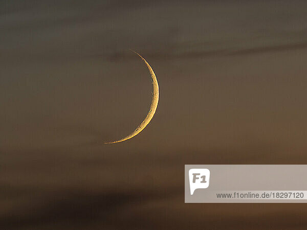 View of crescent moon at dusk