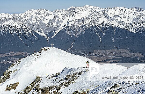 View of the Inn Valley  ski tourers at the summit of the Pirchkogel  mountains in winter  Sellraintal  Kühtai  Tyrol  Austria  Europe