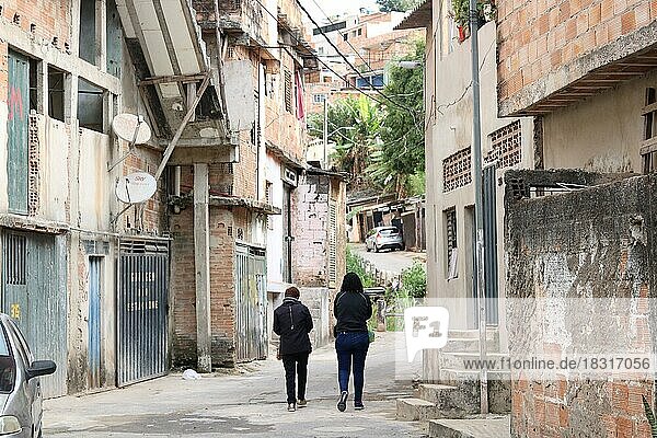 Favela  two woman walking on the street  Belo Horizonte  Minas Gerais  Brazil  South America