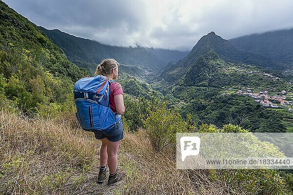 Hiker overlooking a mountain valley  Boaventura  Madeira  Portugal  Europe