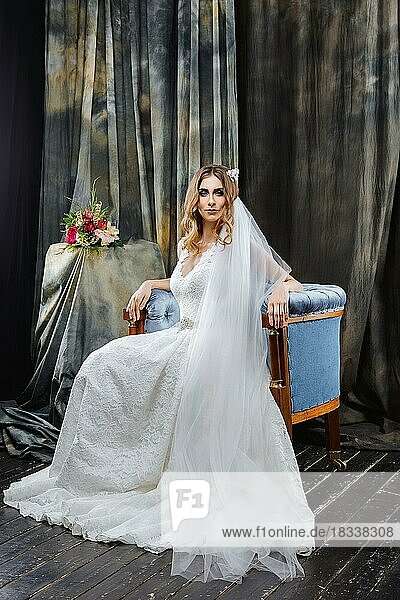 Portrait of pretty bride in wedding dress