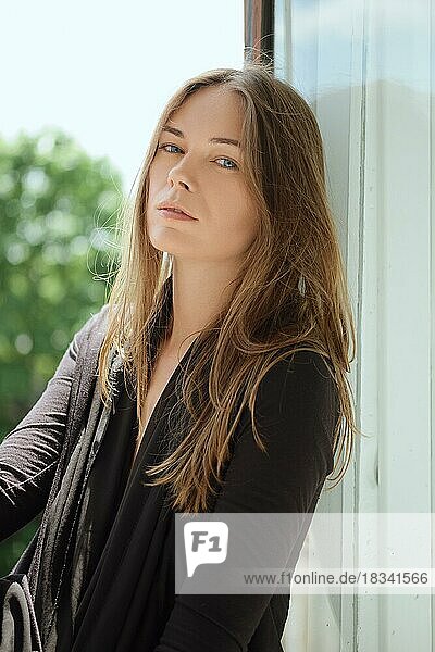 Sensual lifestyle portrait of beautiful woman model with no makeup and clean healthy skin