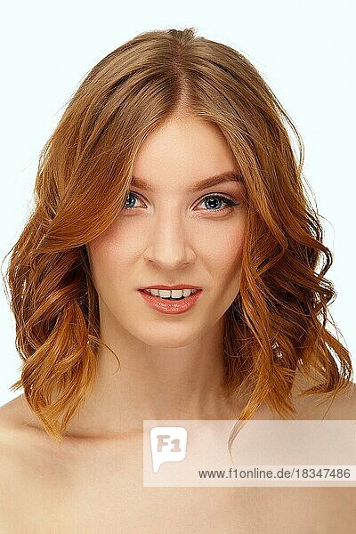 Face of beautiful young woman with blue eyes and red lips. Beauty portrait  fresh skin. Natural makeup