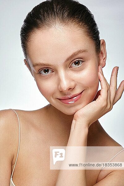 Portrait of beautiful woman with light natural make-up and perfect skin