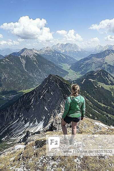 Hiker at the summit of Thaneller  Eastern Lechtal Alps  Tyrol  Austria  Europe