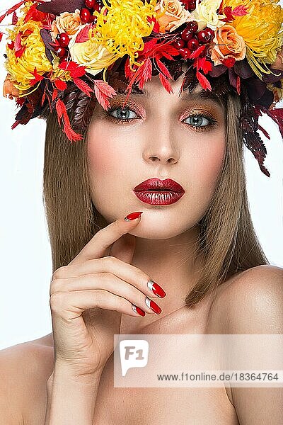Beautiful girl with bright autumn leaves. Beauty face. Picture taken in the studio on a white background