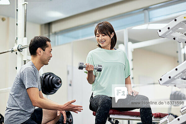 Japanese couple training at indoor gym