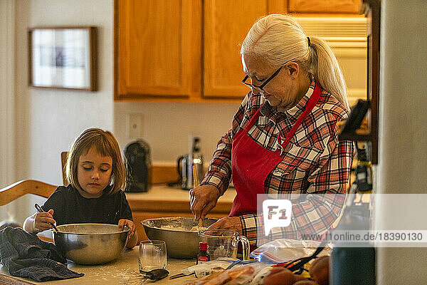 grandmother and granddaughter bake cookies near Sun Valley Idaho
