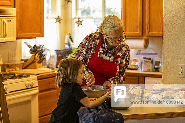 grandmother and granddaughter bake cookies near Sun Valley Idaho