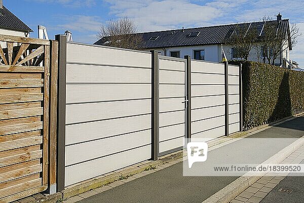 Modern fence in front of terraced house  WPC privacy fence  North Rhine-Westphalia  Germany  Europe