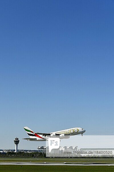 Take-off Emirates Airlines special livery 50th anniversary of the UAE United Arab Emirates Airbus A380-800 with tower in the background  Munich Airport  Upper Bavaria  Bavaria  Germany  Europe