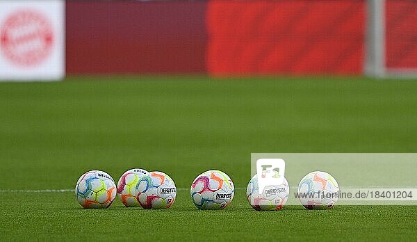 Adidas Derbystar match balls lie on grass  FC Bayern Munich logo  FCB  Allianz Arena  Munich  Bavaria  Germany  Europe