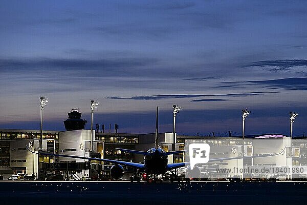 Lufthansa Airbus A350-900 New Livery being towed to position to Terminal 2 by tow truck at dusk  Munich Airport  Upper Bavaria  Bavaria  Germany  Europe