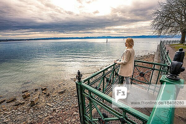 Woman on balcony at the beach  Friedrichshafen  Lake Constance  Germany  Europe