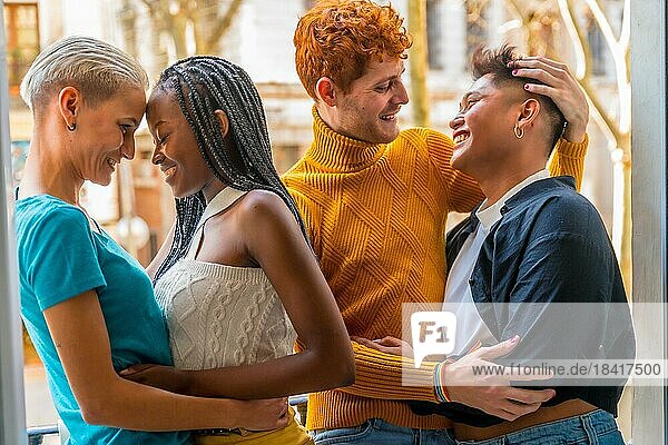Portrait of couples of gay guys and lesbian girls hugging together  lgtb concept