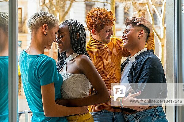 Portrait of couples of gay guys and lesbian girls in a pose of love  lgtb concept