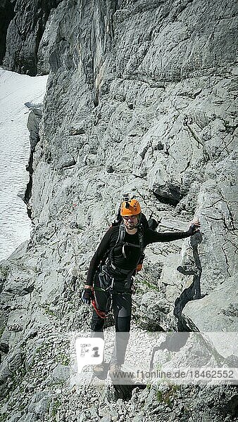 Tourist with equipment on the via ferrata trail in the alps. Zugspitze massif  Bavarian Alps  Bavarian Alps  Germany  Europe