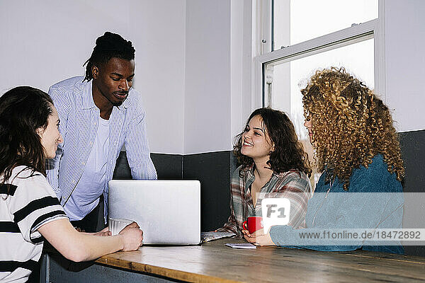 Businessman planning strategy with businesswomen in office