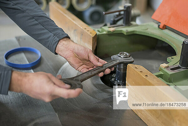 Craftsman fastening nut with wrench in workshop