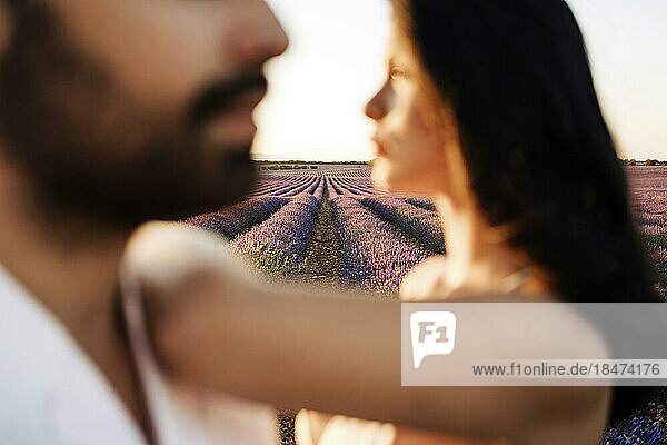 Young woman and man in lavender field