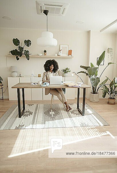 Businesswoman with Afro hairstyle working in office