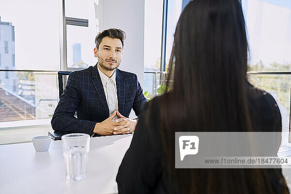 Recruiter taking interview of candidate at office