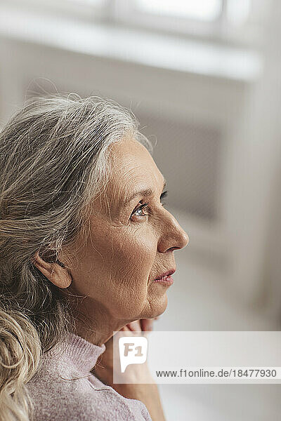 Thoughtful senior woman with gray hair