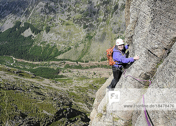 Happy woman climbing mountain Pillar  Western Fells  Lake District  England