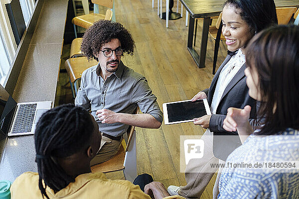 Multiracial business colleagues planning strategy in meeting at office