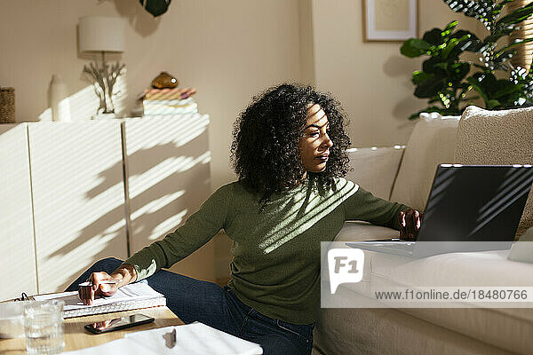 Freelancer using laptop in home office
