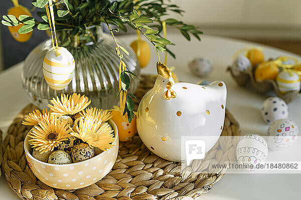 Easter eggs and decoration on table at home