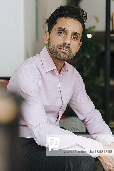 Mature businessman sitting in office