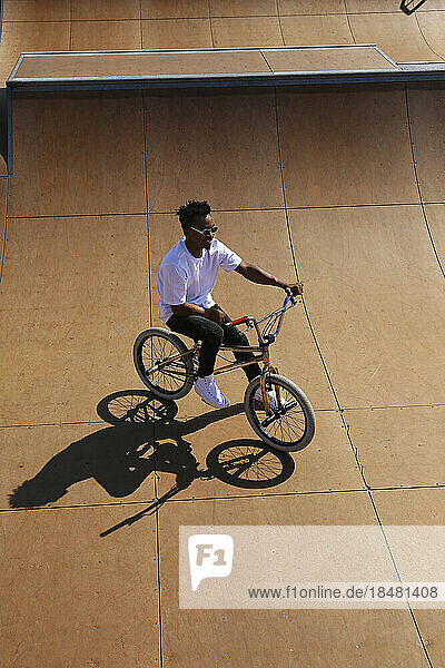 Man on BMX bike at skatepark