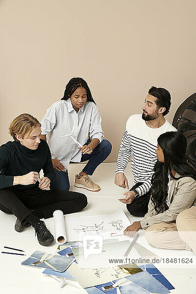 Multiracial business colleagues planning in meeting at office