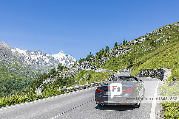 Austria  Salzburg  Sports car driving along Grossglockner High Alpine Road in summer