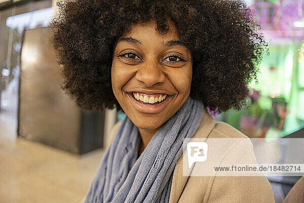 Cheerful woman with Afro hairstyle