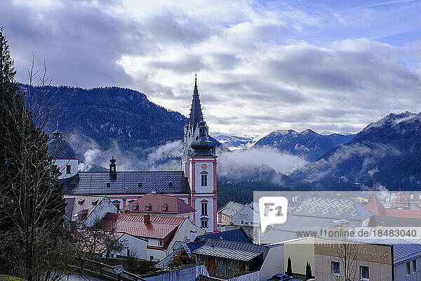 Austria  Styria  Mariazell  Mariazell Basilica and surrounding houses at foggy dawn