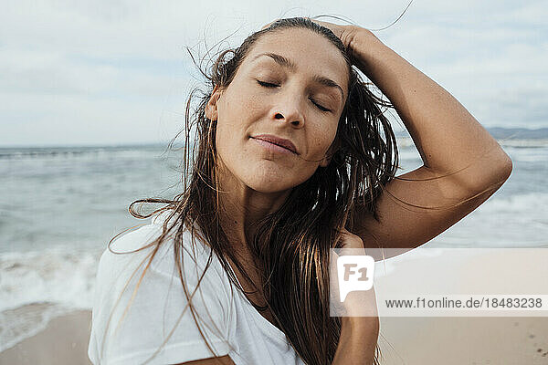 Woman with eyes closed at beach