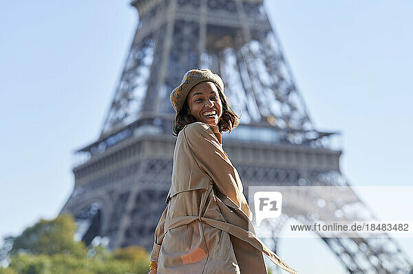Happy young woman enjoying in front of Eiffel tower  Paris  France