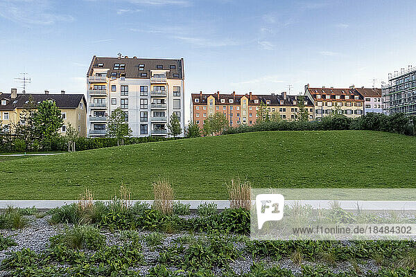 Germany  Bavaria  Munich  Grassy area in front of newly built apartment buildings