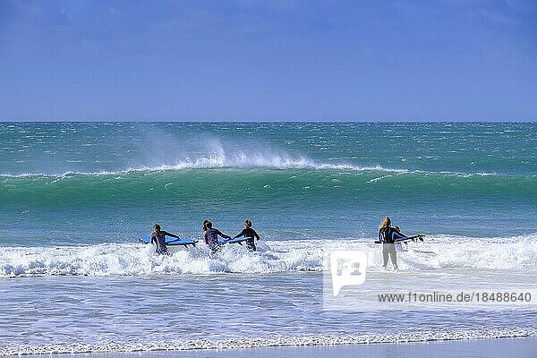 Surfers on the beach  Jeffreys Bay near Port Elizabeth  Garden Route  Eastern Cape  South Africa  Africa