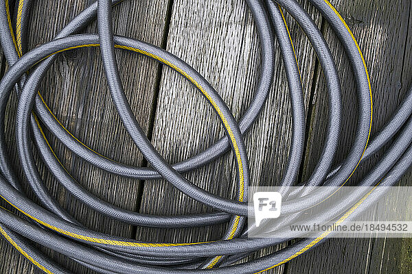 A coiled water hose  view from above.