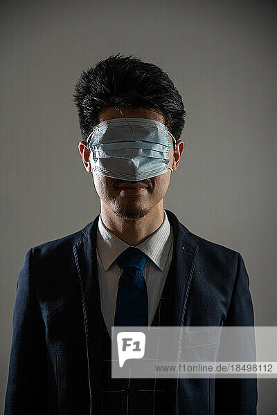 Man wearing a mask over his eyes