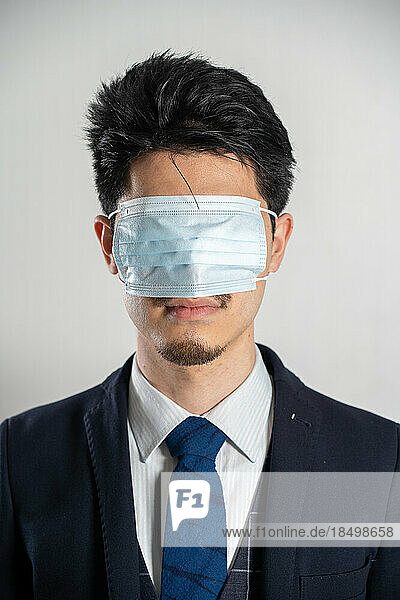 Man wearing a mask over his eyes