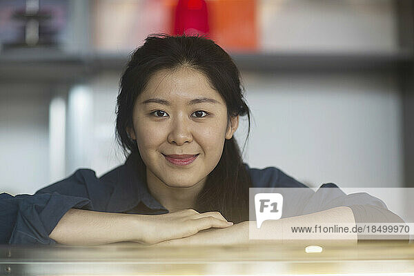 Portrait of a young waitress at coffee shop counter  Freiburg Im Breisgau  Baden-württemberg  Germany