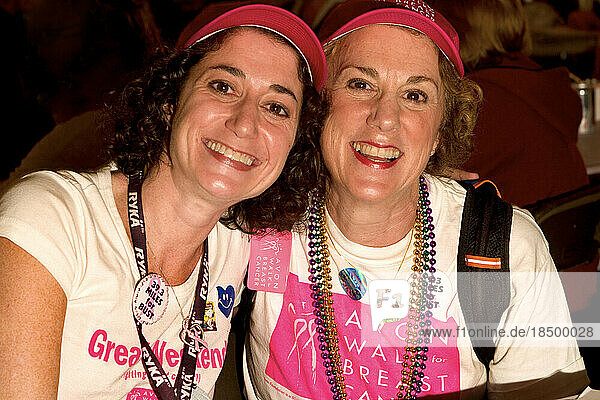 Mother and daughter breast cancer survivor team walk in the Avon Walk for Breast Cancer in New York City.