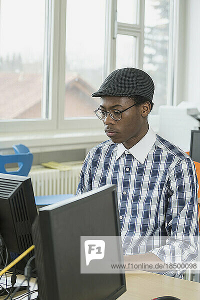 University student working on computer in Laboratory School  Bavaria  Germany