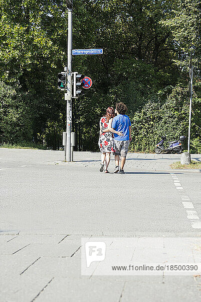Couple crossing the Prince Regent Street